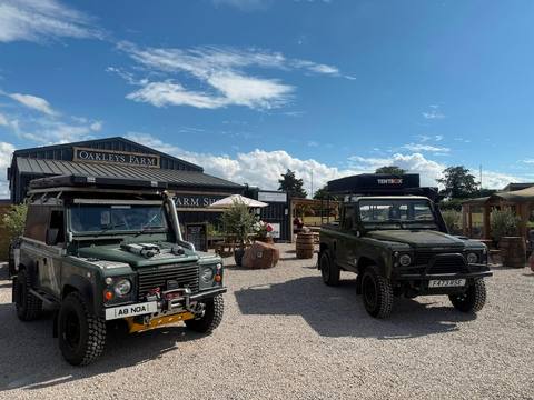 Land Rovers parked up outside the farm shop