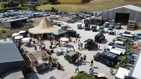 Tea on the Tailgate from the air - the tipi ringed by Land Rovers