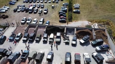 Rows of Land Rovers parked up for the day