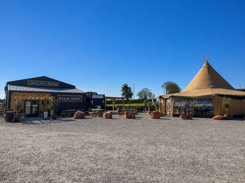 The farm shop and the tipi, seen from the car park