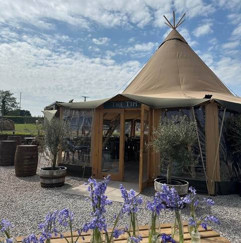 Inside the tipi, set up for an event